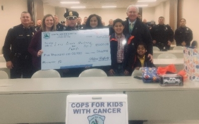 CFKWC and Worcester Police Department donate to 5-year-old Luiz Jimenez and his family.