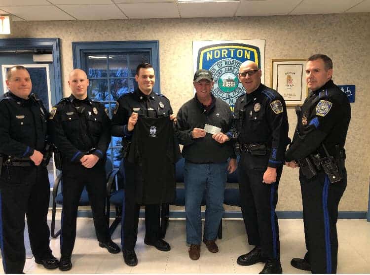 Norton Police Department present a check to CFKWC for No Shave November 2019