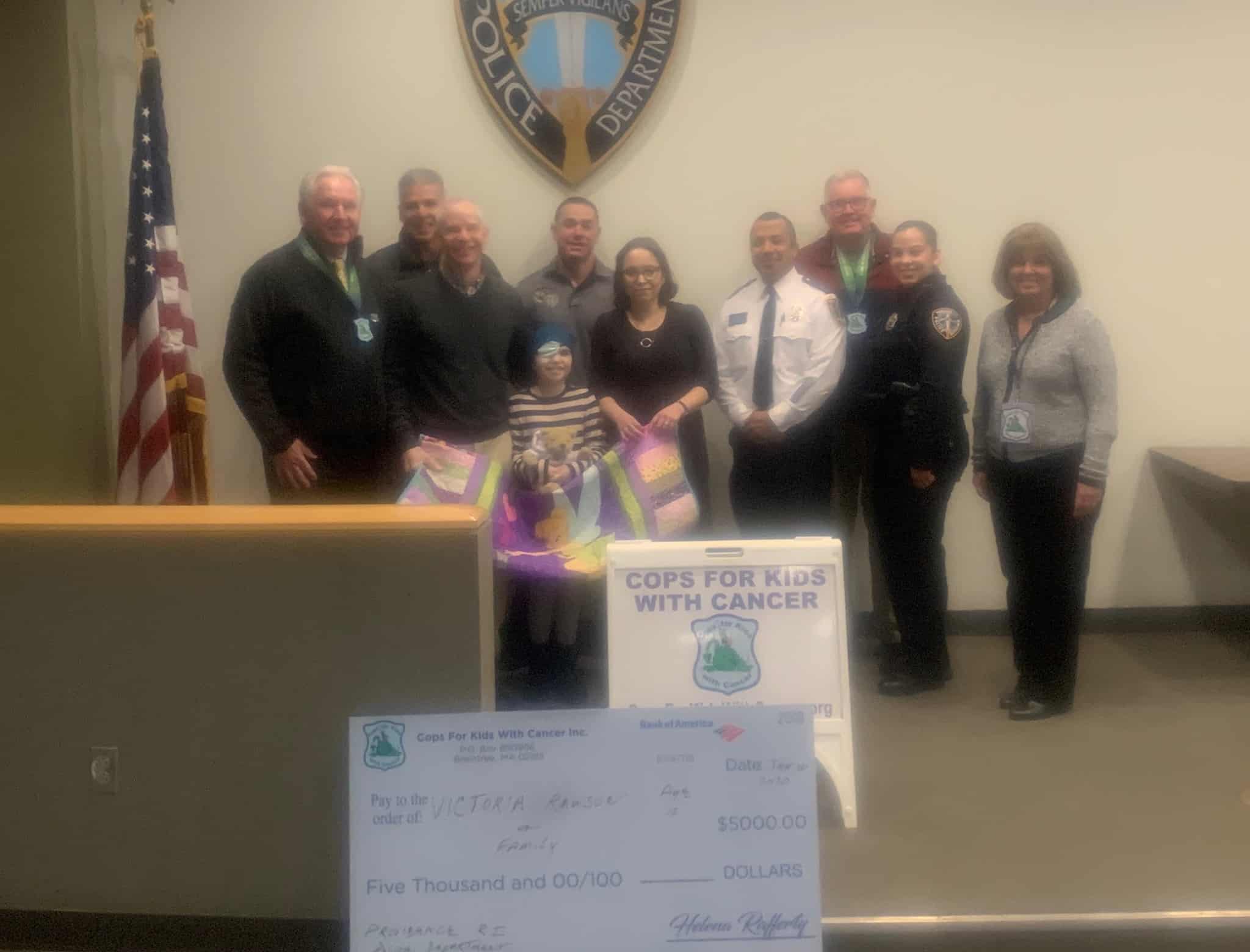CFKWC make donation to Victoria Rawson, 10 yrs., and her parents at the Public Safety Complex in Providence, RI