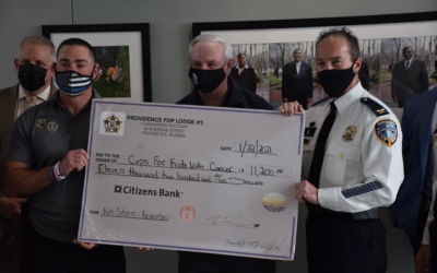 Check donation of $11,200 for CFKWC No Shave November Campaign