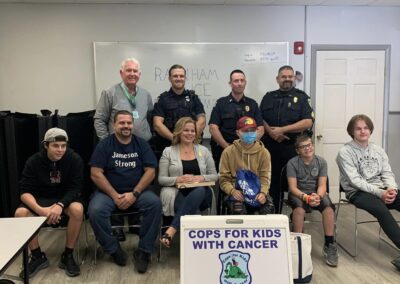 Raynham Police Department make a donation to 15 year old Jameson Marrone