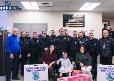 Paul Ivens and Steve DaCorta of CFKWC, Went to Boston Police District C-11, and made a donation to 5 yr old Celia
