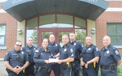 Chief Helena Rafferty accepted an $8,000.00 donation check from the officers of the Somerset Police department