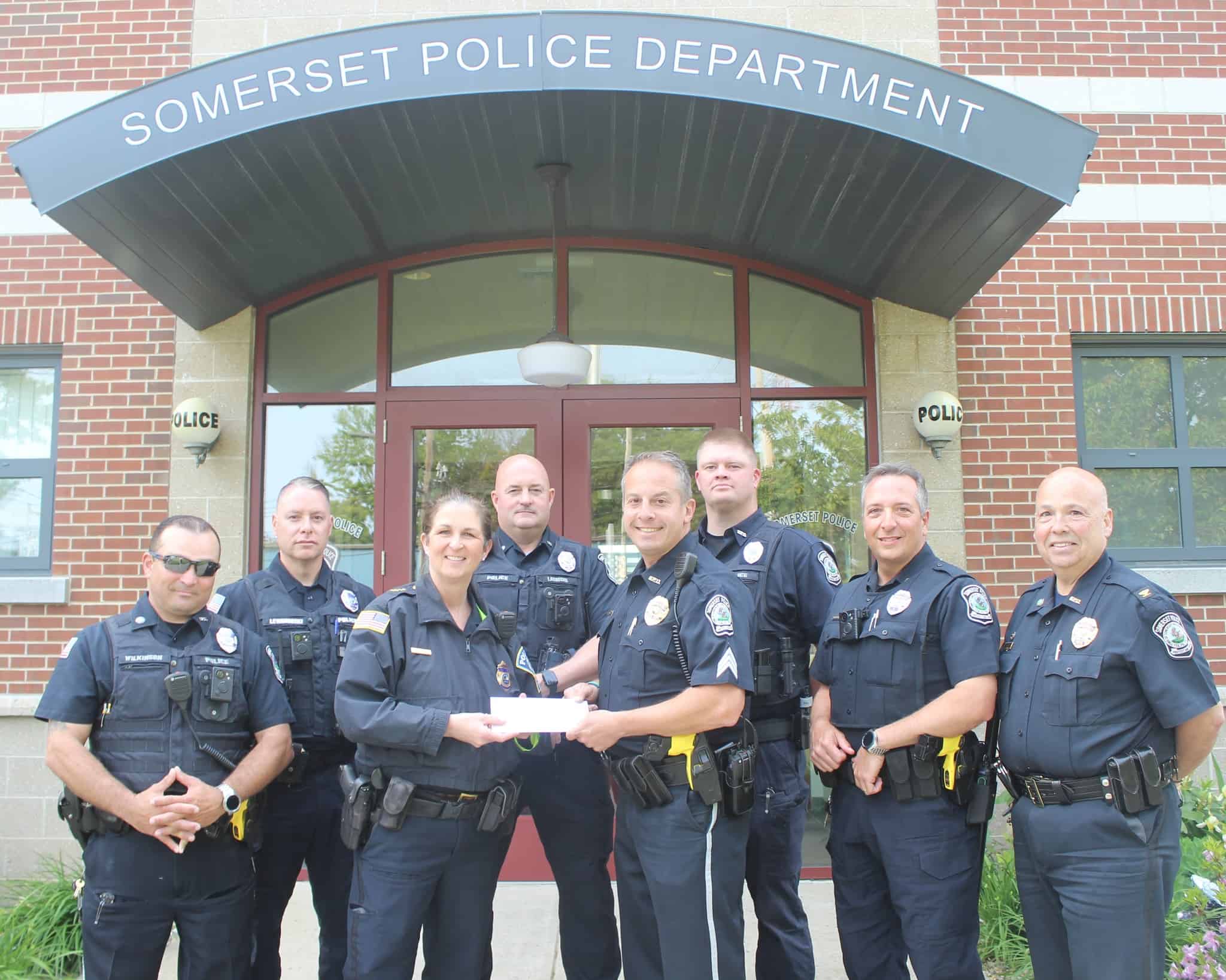 Chief Helena Rafferty accepted an $8,000.00 donation check from the officers of the Somerset Police department