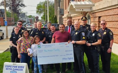 Lt. Hannagan and Sgt. Sal Mirabello, of CFKWC made a donation to the Alves Family at the Framingham Police Department. Taciele Alves is an 8 year old girl battling a brain tumor.