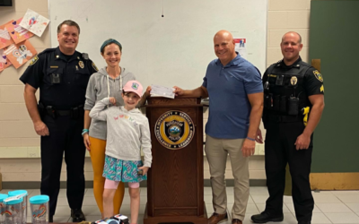 Tom Grenham of CFKWC, Made a donation at the Hingham Police Dept. to Adelia and her Mom, Meryl