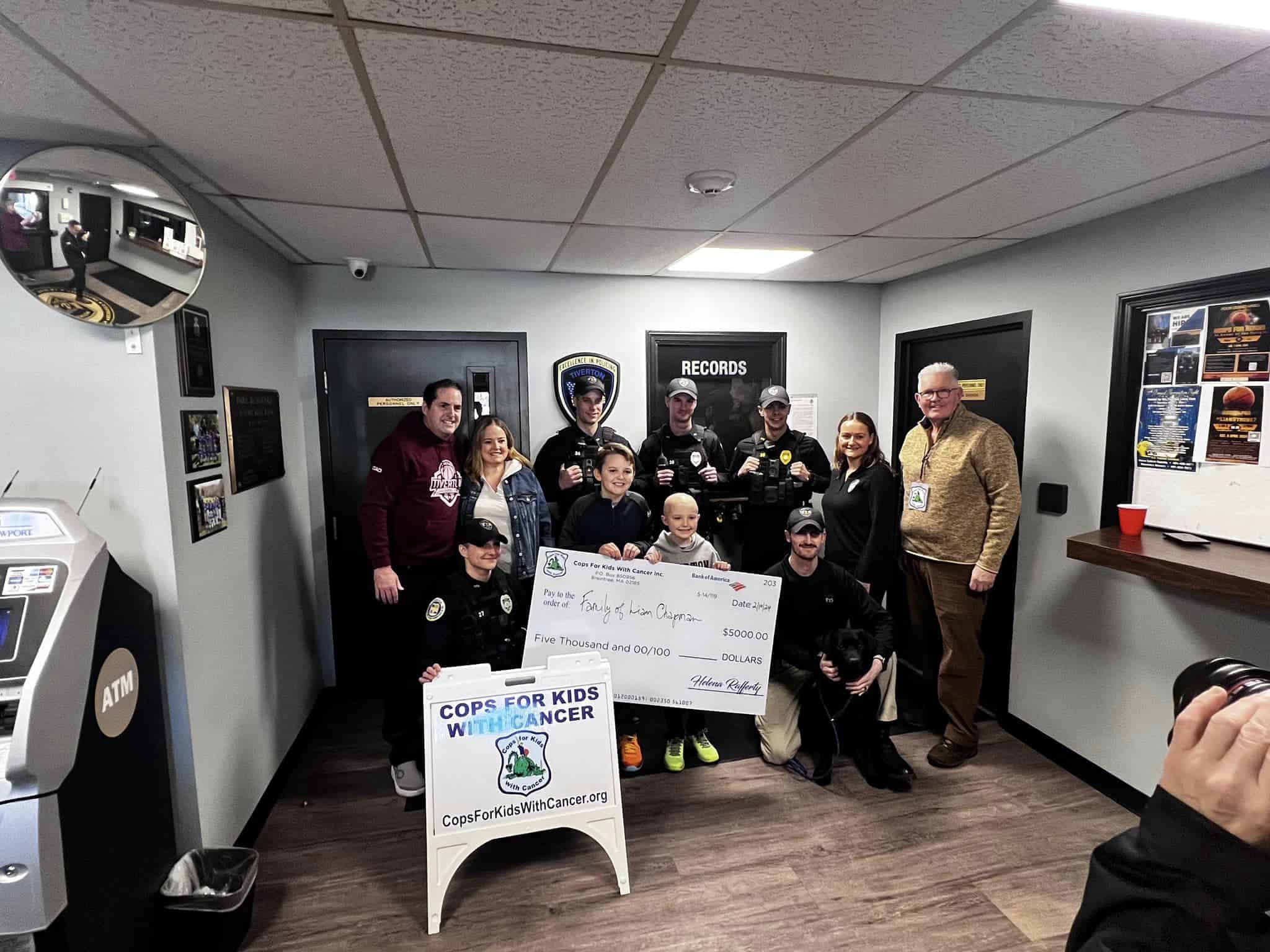Kevin Calnan of CFKWC made a donation to Liam and his family at the Tiverton, RI.Police Dept.