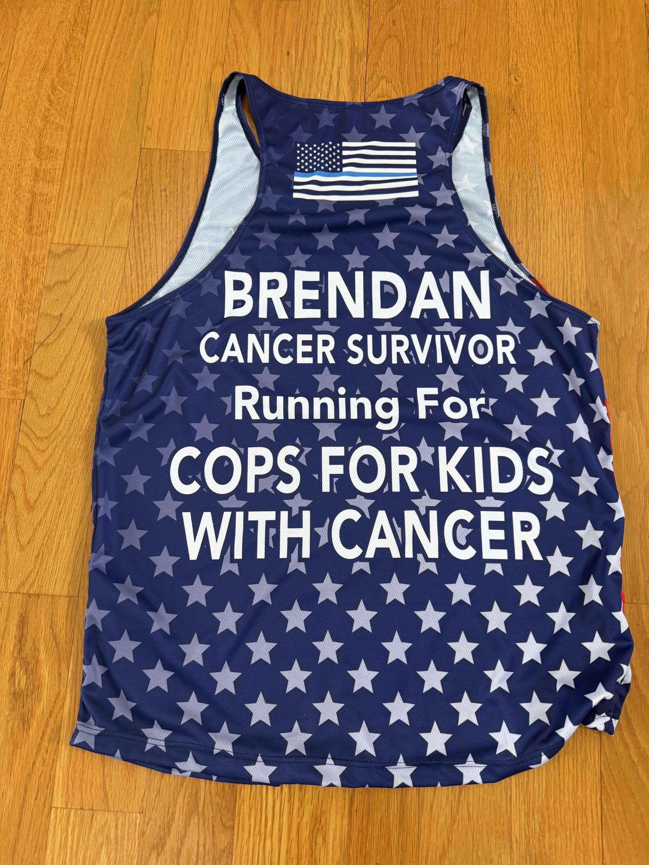 Four male participants of the 2026 Official Boston Marathon Charity Team benefiting Cops for Kids with Cancer.