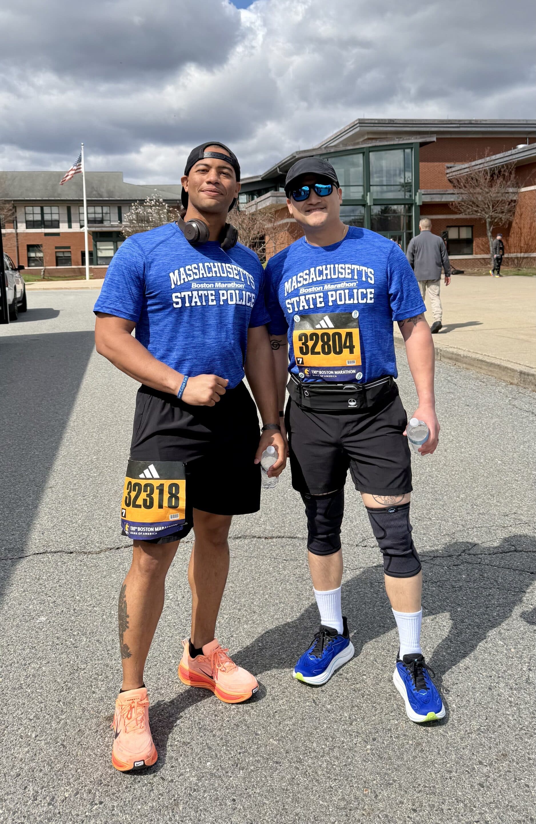 Two male participants in their running tank tops.