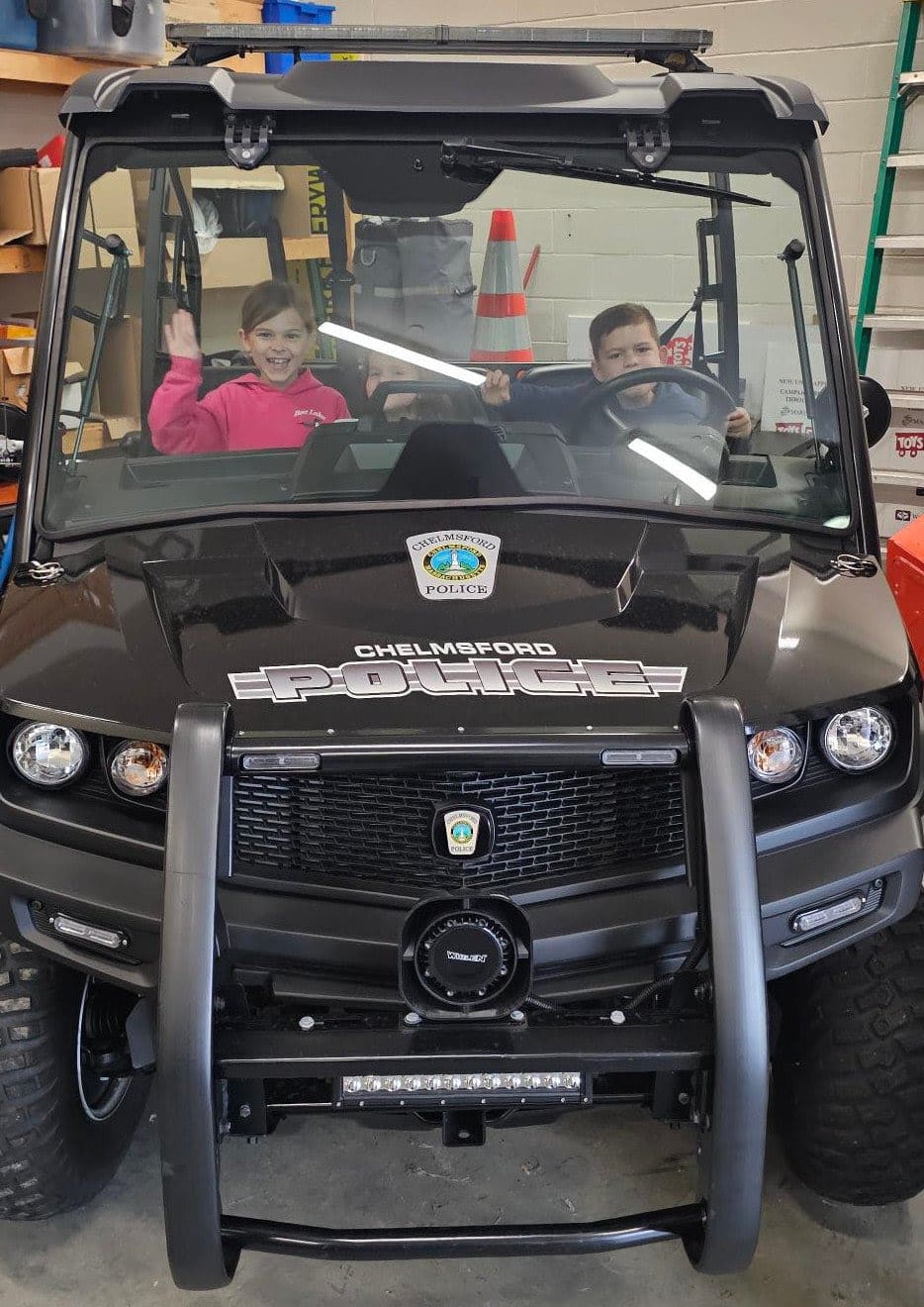 Tyler Bolger and his sisters got to check out a Chelmsford Police ATV during their visit to the police station.